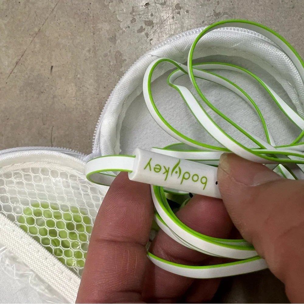 4 Green and White Earbuds with Case