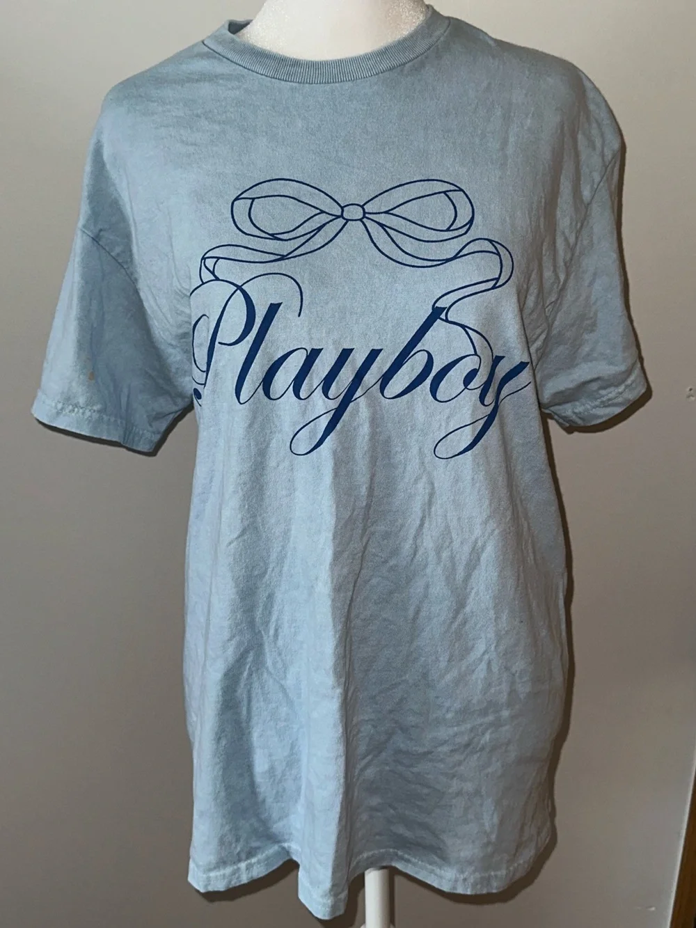 PLAYBOY Bow Cursive Logo Light Blue Short Sleeve Stylish Essential Tee- Women’s